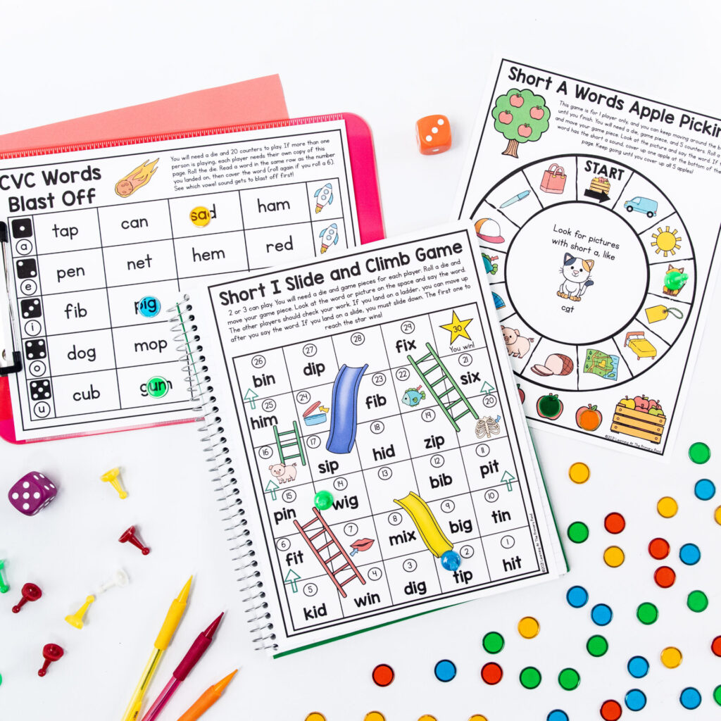 These are CVC word board games, including "slide and climb" and "roll and read."